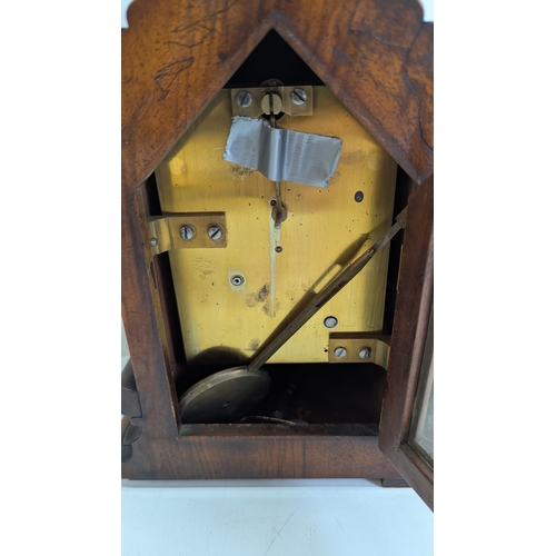 42 - Antique Carved Walnut Bracket Clock

Ornately carved case with prominent floral and foliate decorati... 