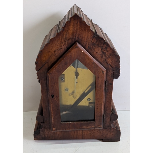 42 - Antique Carved Walnut Bracket Clock

Ornately carved case with prominent floral and foliate decorati... 