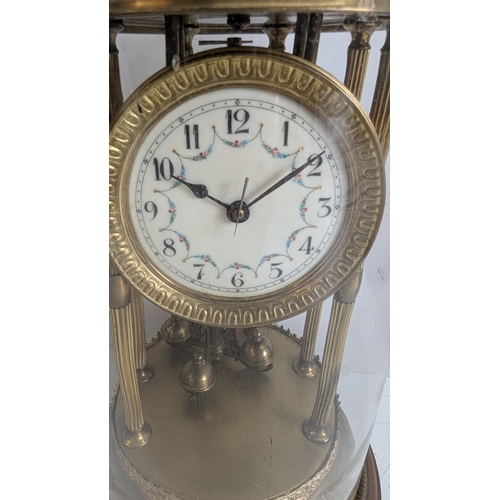 44 - Antique Brass Four-Glass Anniversary / Torsion Clock Under Glass Dome

Decorative enamel dial with A... 
