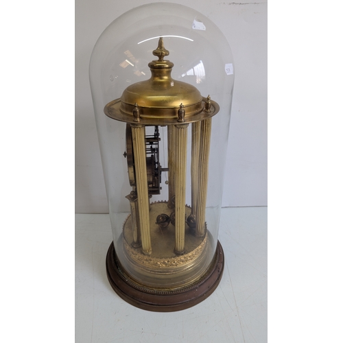 45 - Antique Brass Four-Glass Anniversary / Torsion Clock Under Glass Dome

Cream dial with stylised Arab... 