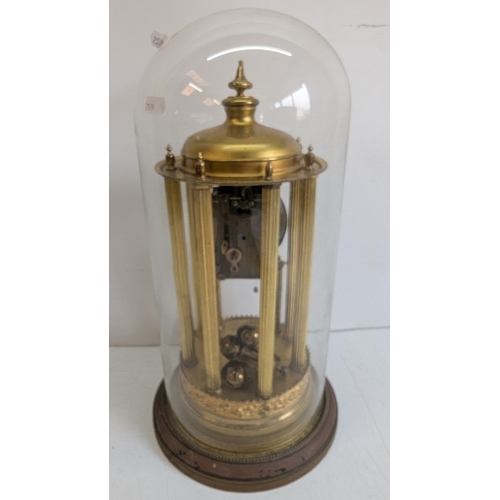 45 - Antique Brass Four-Glass Anniversary / Torsion Clock Under Glass Dome

Cream dial with stylised Arab... 