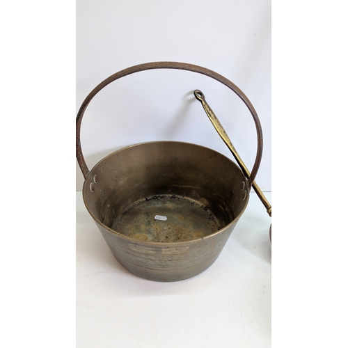 52 - Collection of Antique Brass & Iron Hearth / Kitchen Utensils

Comprising a large brass cauldron or p... 