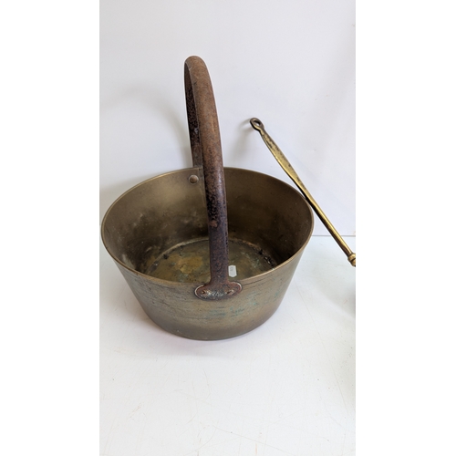 52 - Collection of Antique Brass & Iron Hearth / Kitchen Utensils

Comprising a large brass cauldron or p... 