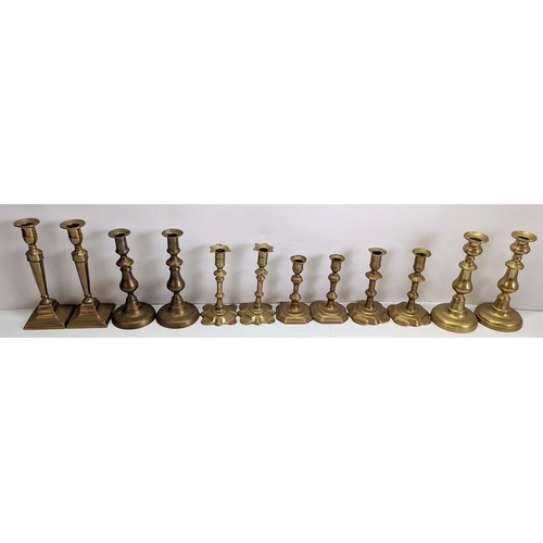 54 - Collection of Twelve Vintage Brass Candlesticks

Comprising six pairs of varying traditional forms, ... 