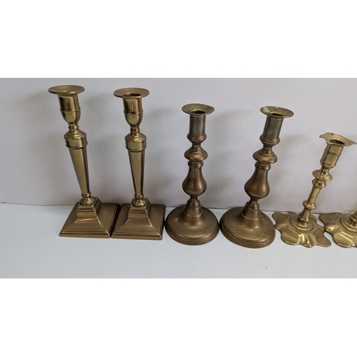 54 - Collection of Twelve Vintage Brass Candlesticks

Comprising six pairs of varying traditional forms, ... 
