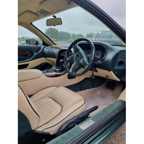 113 - 1 x 1995 Aston DB7 3.3 litre petrol in green with cream leather interior approx 21000 miles on the c... 