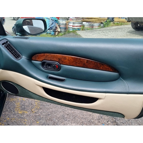 113 - 1 x 1995 Aston DB7 3.3 litre petrol in green with cream leather interior approx 21000 miles on the c... 