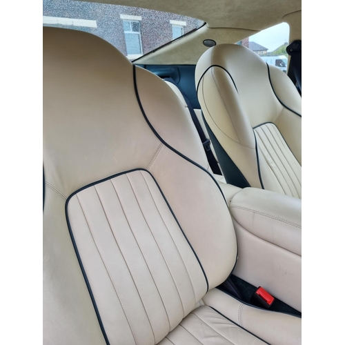 113 - 1 x 1995 Aston DB7 3.3 litre petrol in green with cream leather interior approx 21000 miles on the c... 