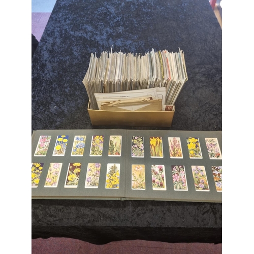 202 - 1 x box containing various age postcards with book