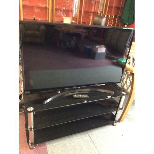 25 - 1 x lg 49 inch flat screen smart television with black glass stand