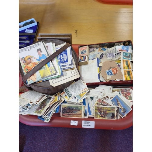 129 - Large selection of cigarette cards with stamps and postcards