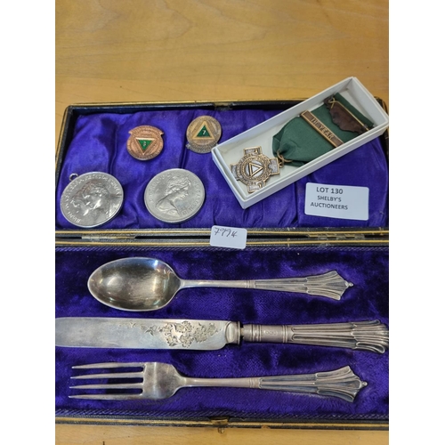 130 - Silver cased cutlery set with driver awards etc