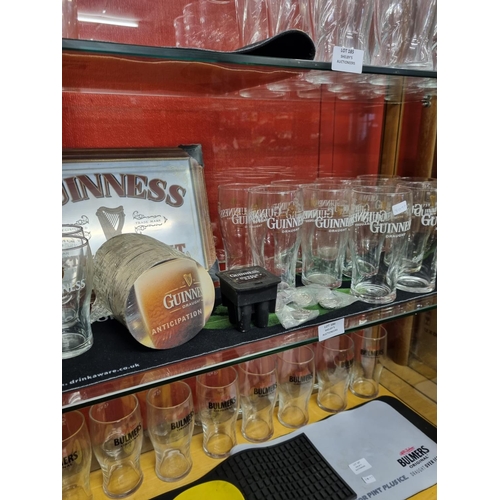 186 - 11 x Guinness pint glasses 4 half pints Guinness nozzle safe keyrings mirror beer mats etc