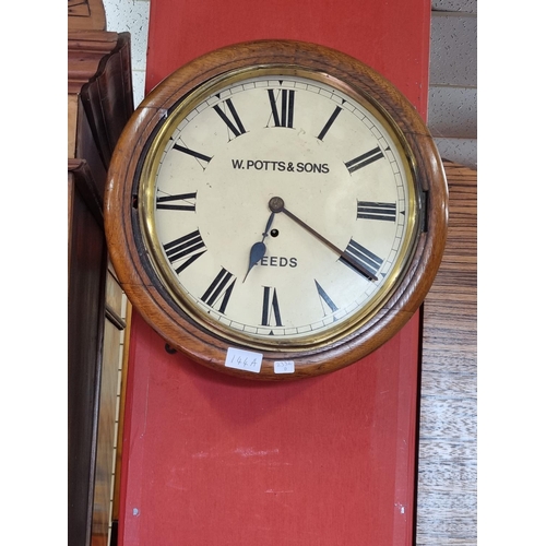 144A - One W Potts and Sons Leeds oak mounted wall clock