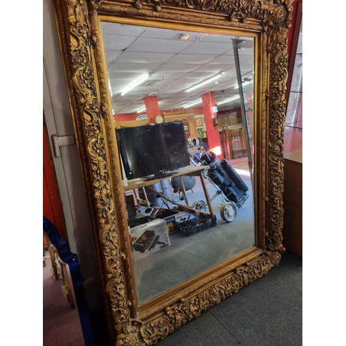 22 - 1 x very large gilt framed floral design edge mirror has damage on corner of frame 54inch by 72 inch