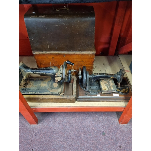 358 - Two hand powered singer sewing machine Not in good condition