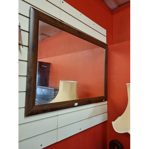 46 - One mahogany framed wall mirror
