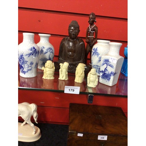 179 - Selection of Oriental figures with four made in China versus wooden Buddha etc