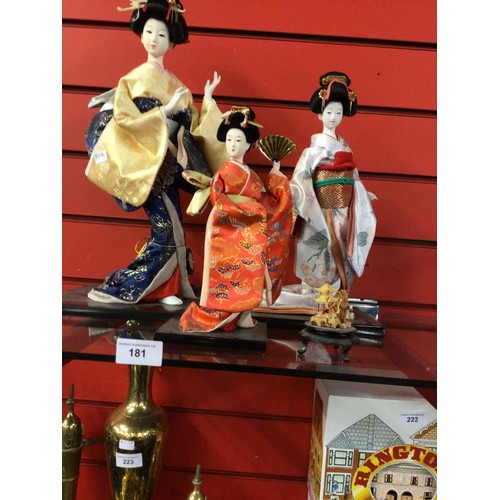 181 - Three times various Oriental lady figurines with cork miniature model