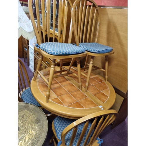 185 - 1 x tile topped extending dining table with 4 chairs