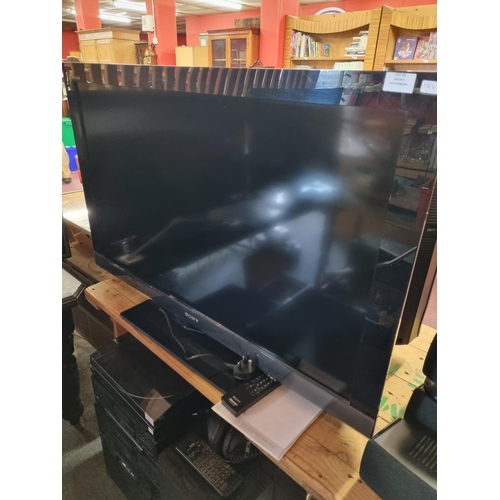 21 - Sony Bravia 40inch Flatcreen TV (w/ remote and manual)