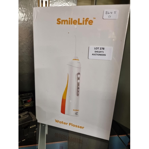 278 - 1x smilelife water flosser (brand new in box)