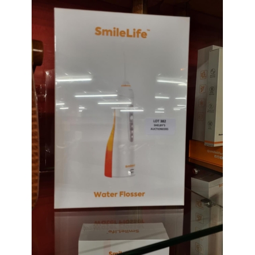 382 - 1x smilelife electric water flosser (sealed in box)