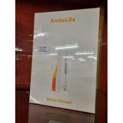 390 - 1x smilelife electric water flosser (sealed in box)