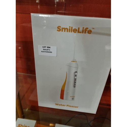 394 - 1x smilelife electric water flosser (sealed in box)