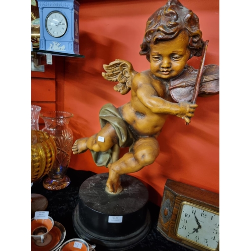 487 - 1x large cupid figurine on stand