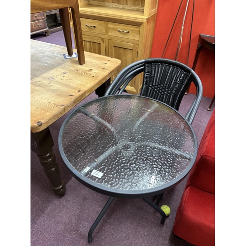 71 - 1x metal and glass topped garden table with four rattan chairs