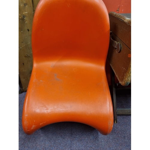 89 - 1 x Verner Panton red plastic moulded chair with Verner Panton on base.