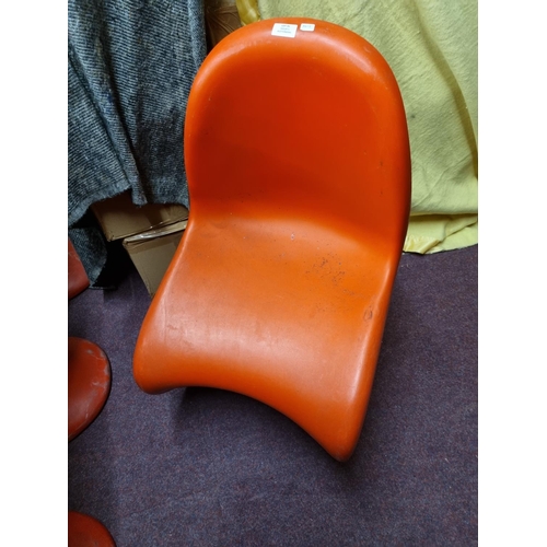 91 - 1 x Verner Panton red plastic moulded chair with Verner Panton on base.