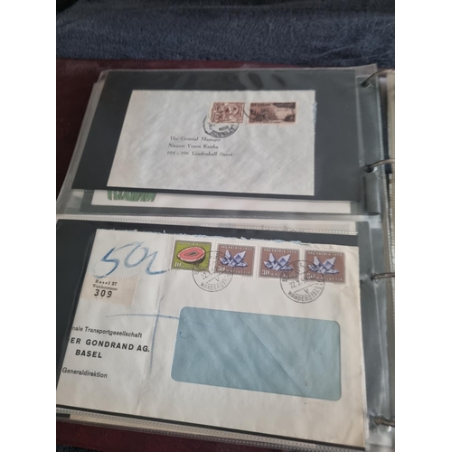 163 - ALBULM CONTAINING FIRST DAY COVERS AND FOREIGN USED STAMPS