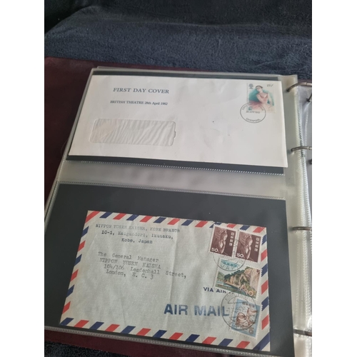 163 - ALBULM CONTAINING FIRST DAY COVERS AND FOREIGN USED STAMPS