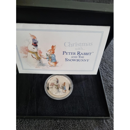 57 - MINT EDITIONS CHRISTMAS WITH PETER RABBIT AND THE SNOW BUNNY LTD EDITION SILVER COIN 121 /500