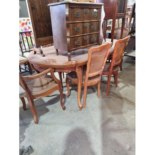 42 - 1 x carved detail dining table with 2 bergere carvers and 4 chairs