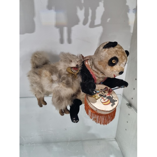 180 - 1 X 1950S WIND UP CLOCK WORK PANDA WITH FUR DOG