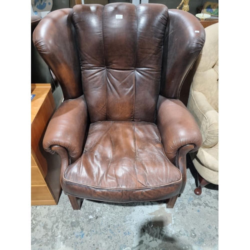 44 - 1 X BROWN LEATHER WING BACK ARM CHAIR