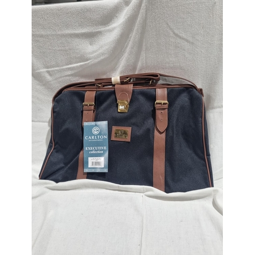 382 - 1 X NEW IN PACKAGE CARLTON CANVAS AND LEATHER TRAVEL BAG