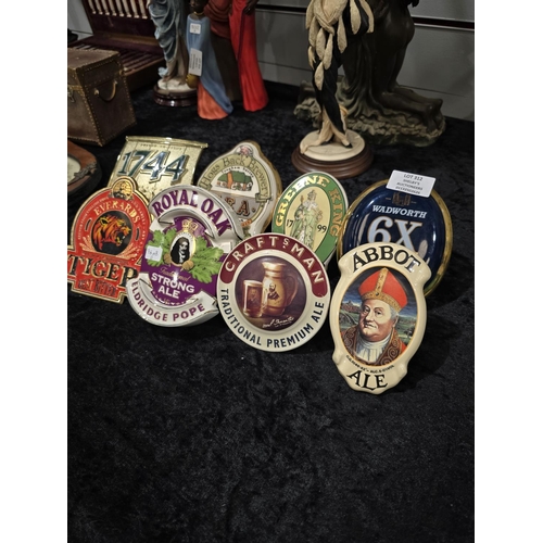 312 - SELECTION OF VARIOUS POTTERY AND METAL PUB PUMP ADVERTISEMENTS