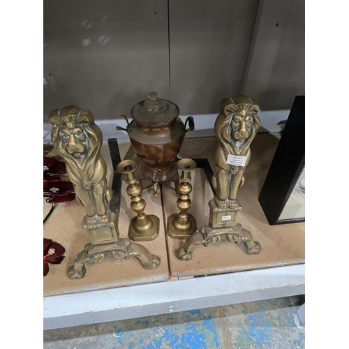 345 - PAIR OF BRASS FIRE DOGS WITH CANDLE STICKS AND URN