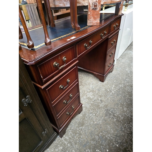 45 - 1 X PEDESTAL LEATHER TOPPED DESK DOES HAVE A SMALL TEAR IN THE LEATHER TOP