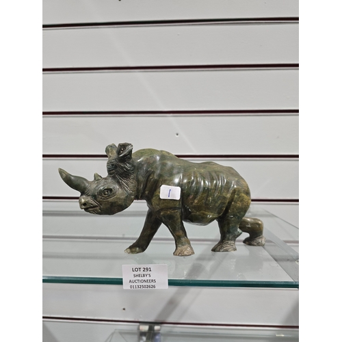 291 - 1 X SOAPSTONE RHINO IGURINE HAS DAMAGE TO EAR AND ON FRONT FOOT