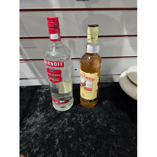 256 - 1 X BOTTLE OF SMIRNOFF WITH FAMOUS GROUSE WHISKEY