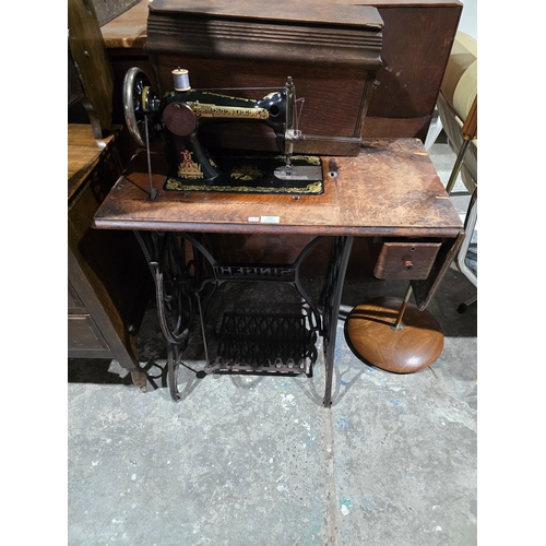 65 - 1 X SINGER TREADLE SEWING MACHINE ON STAND