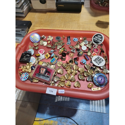 154 - 1 x tray containing various brooches and pin badges