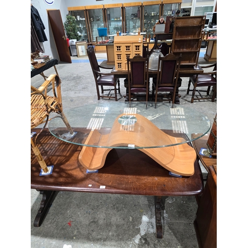 66 - wooden base glass topped coffee table