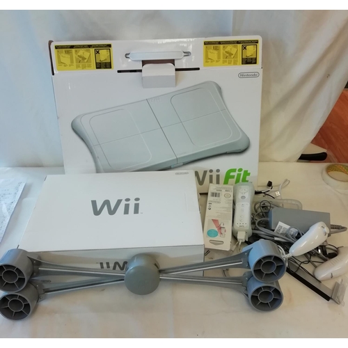 110 - Nintendo Wii complete with Special Lime Green Wii Fit Board and Accessories. Original Boxes. W/O