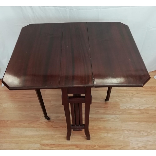 600 - Small Mahogany Drop Leaf Table with Brass Casters 72cm x 61cm x 81cm. This Lot is Collection Only